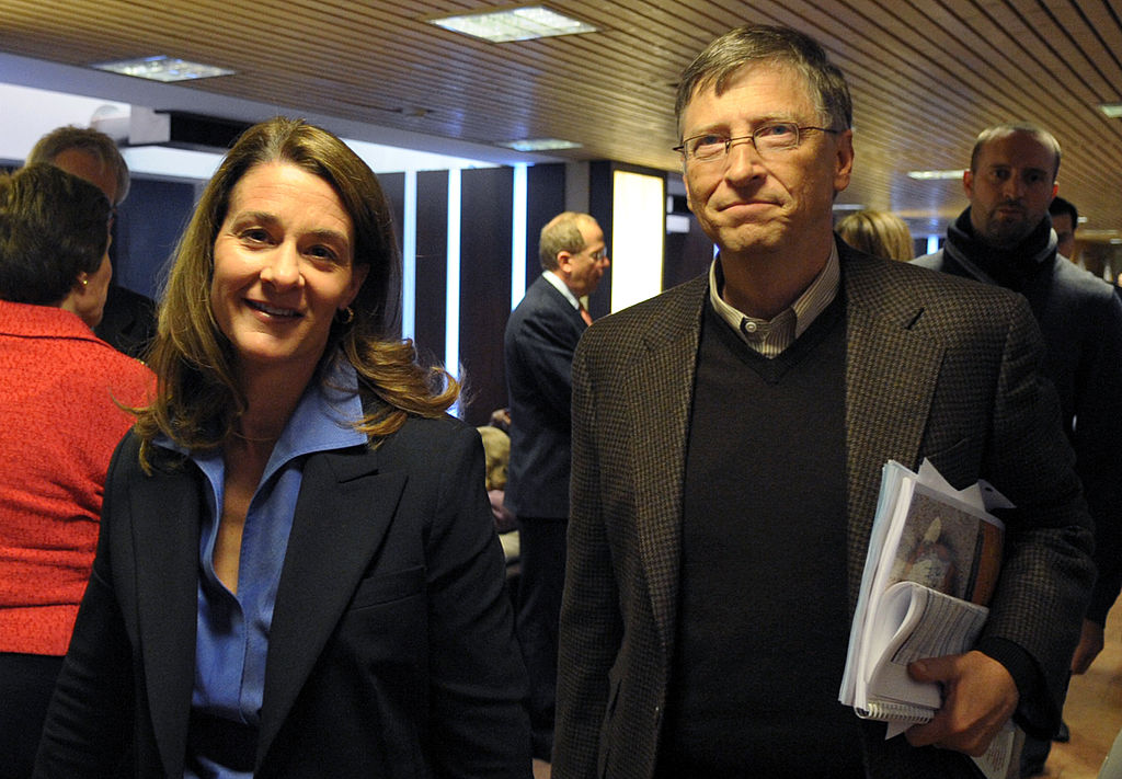 Bill and Melinda Gates walk in the Congr